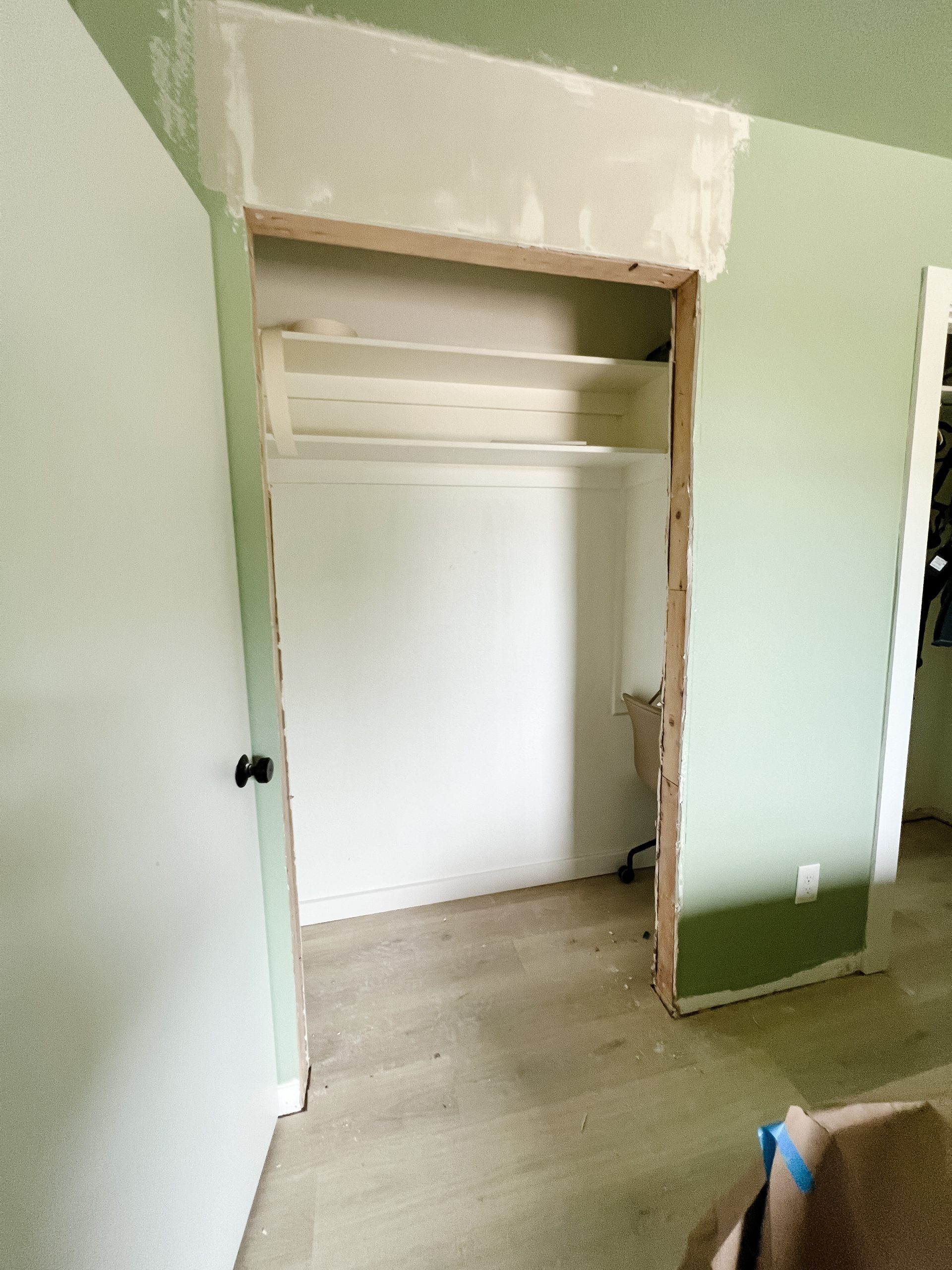 dry wall being put on the framing for the diy desk nook